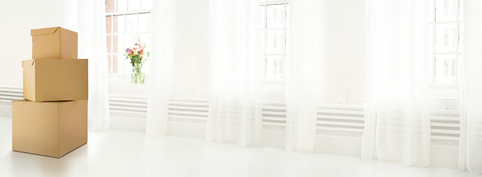 Promotional graphic for The HomeScholar. Text reads: ‘College Packing List – What Your Student Will Need Moving from Homeschooling to College.’ Background shows two stacked cardboard moving boxes in a bright room with a window and flowers on the left.